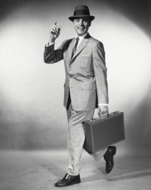 Portrait of a businessman carrying a briefcase Poster Print