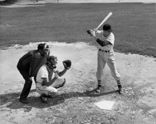 Baseball player swinging baseball bat with baseball catcher and baseball umpire squatting beside him Poster Print - Item # VARSAL2554610
