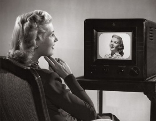 Side profile of a mid adult woman watching television Poster Print - Item # VARSAL2552824