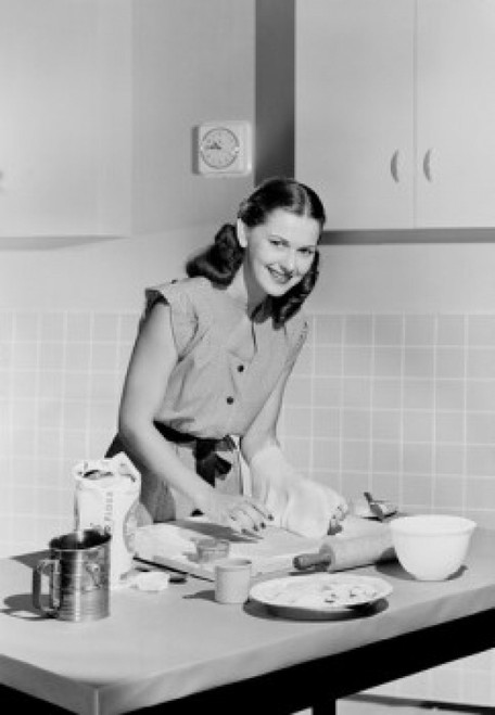 Young woman preparing cake in domestic kitchen Poster Print - Item # VARSAL255422349A