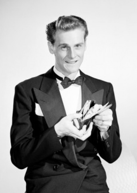 Studio portrait of man holding open wallet Poster Print - Item # VARSAL255420193