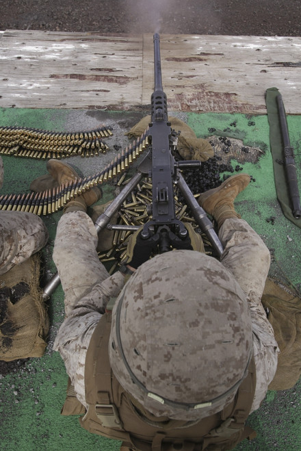 April 10, 2010 - U.S. Marine fires an M2 .50-caliber machine gun during the crew served weapons firing exercise on a range at the Pohakuloa Training Area in Hawaii. Poster Print - Item # VARPSTSTK103526M