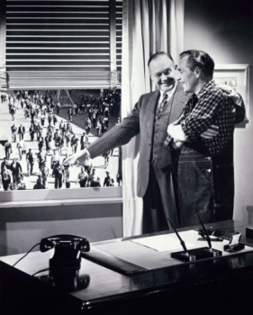 Two men standing together near a window pointing at a group people walking outside Poster Print - Item # VARSAL25518826