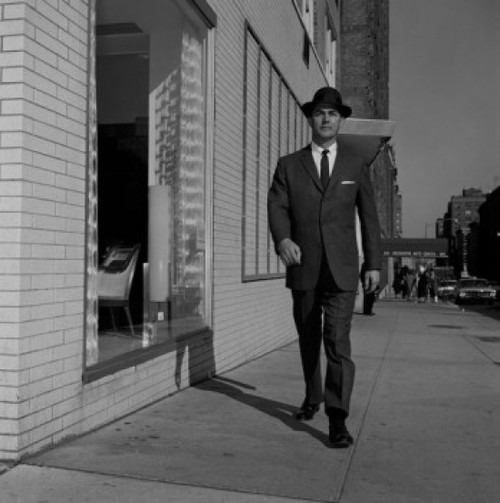 Man in suit walking down street Poster Print - Item # VARSAL255422672