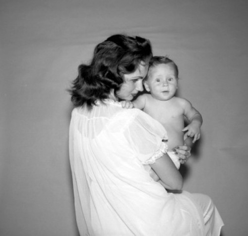 Mother holding baby Poster Print
