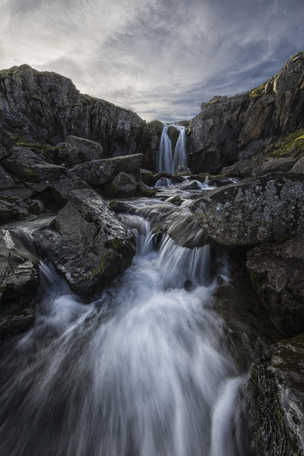 Stream flows over a waterfall along the eastern coast of Iceland; Iceland PosterPrint - Item # VARDPI12296398