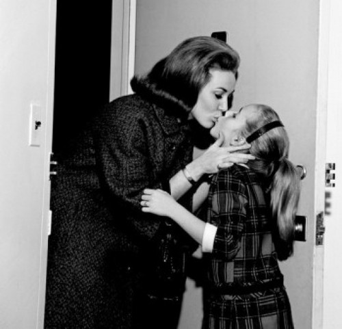Mother kissing daughter goodbye Poster Print - Item # VARSAL255417756