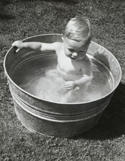 High angle view of a baby boy sitting in a washtub Poster Print - Item # VARSAL2559098