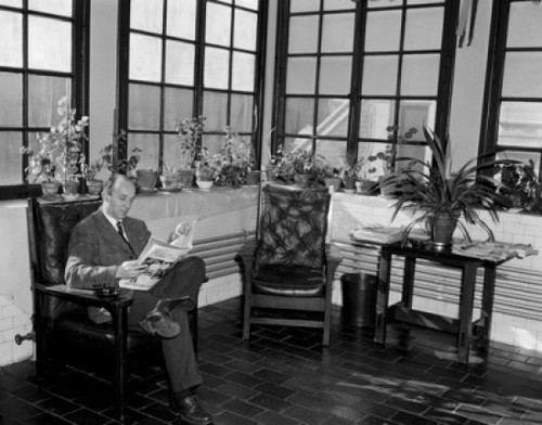 Man sitting in room reading newspaper Poster Print - Item # VARSAL25549191