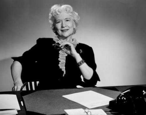 Senior woman sitting at desk Poster Print - Item # VARSAL25528041