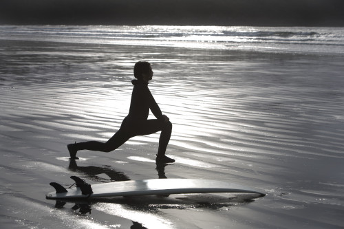 Surfer Stretching On Beach PosterPrint - Item # VARDPI1829337