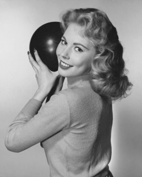 Young woman holding a bowling ball and smiling Poster Print - Item # VARSAL2558882B
