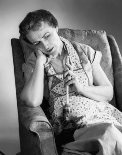 Senior woman sitting on an armchair Poster Print - Item # VARSAL25525167