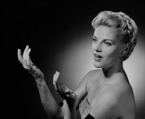 Portrait of mid adult woman gesturing Poster Print - Item # VARSAL255419023