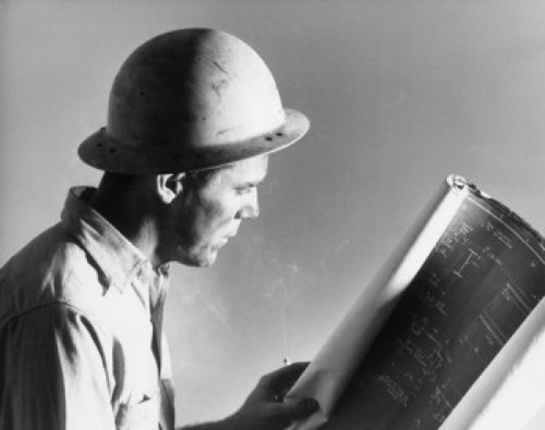 Side profile of a construction worker holding a blueprint Poster Print - Item # VARSAL2553570A
