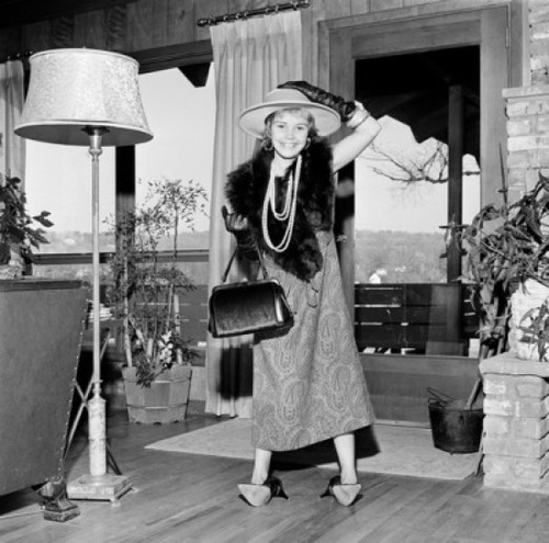 Girl wearing mother's clothing standing in living room Poster Print - Item # VARSAL255418596