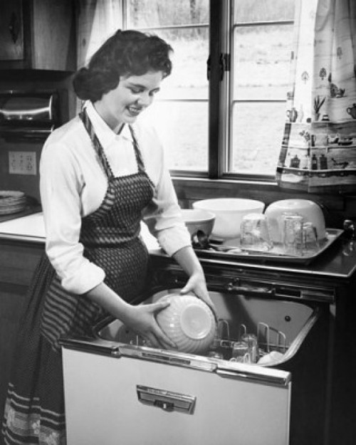 Young woman working in a kitchen Poster Print - Item # VARSAL2559051