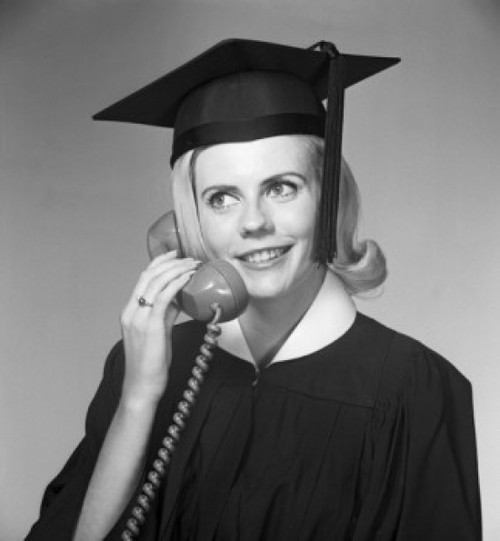 Woman in mortar board talking on phone Poster Print - Item # VARSAL255418094