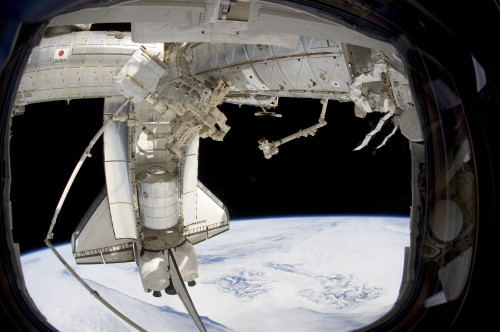 The docked space shuttle Discovery and Dextre Poster Print - Item # VARPSTSTK203644S