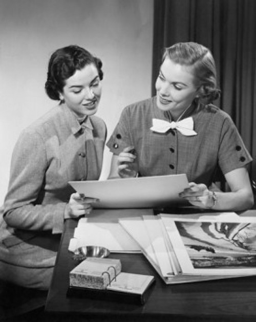Two businesswomen looking at paintings Poster Print - Item # VARSAL2553087