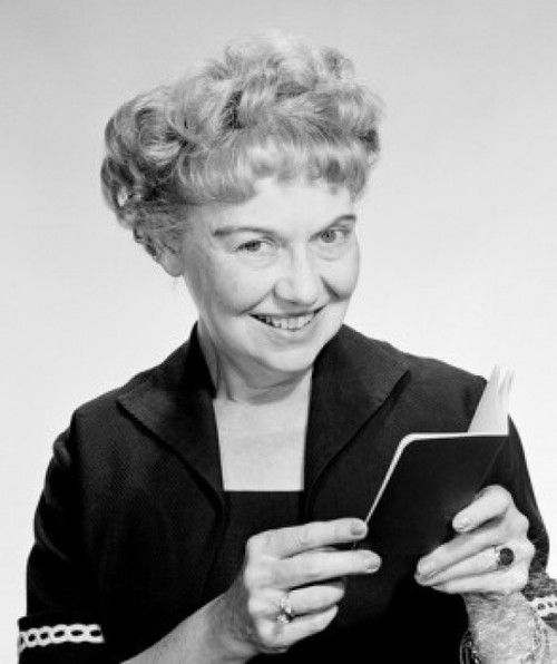Portrait of happy mature woman holding passport  studio shot Poster Print - Item # VARSAL255417800