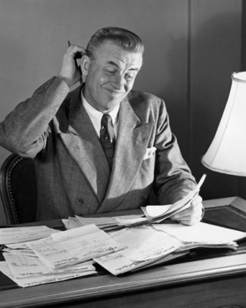 Businessman reading documents in an office Poster Print - Item # VARSAL25548288C