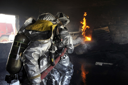 Firefighters extinguish a fire in a training room during live burn training Poster Print - Item # VARPSTSTK103842M