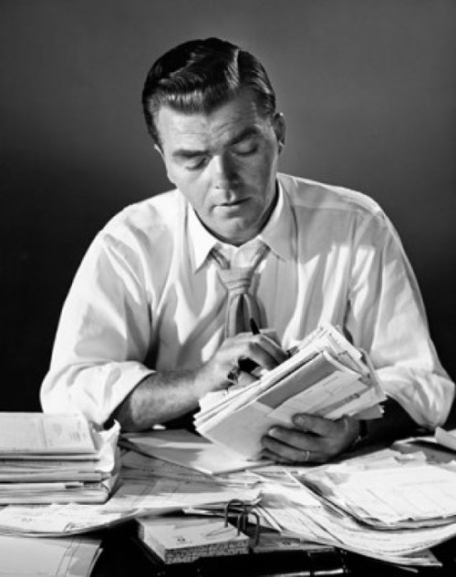 Businessman doing paperwork Poster Print - Item # VARSAL25515686