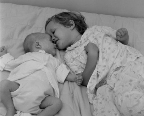 Baby lying with sister on bed Poster Print - Item # VARSAL2551564A