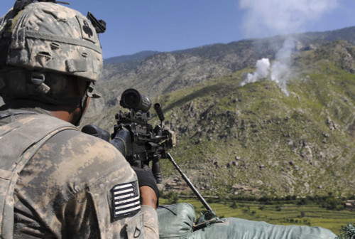 A U.S. Army grenadier scans a nearby ridgeline at a mountaintop observation post in Afghanistan Poster Print - Item # VARPSTSTK104427M