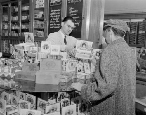 USA  Massachusetts  Man selling tobacco products to customer in shop Poster Print - Item # VARSAL255423342