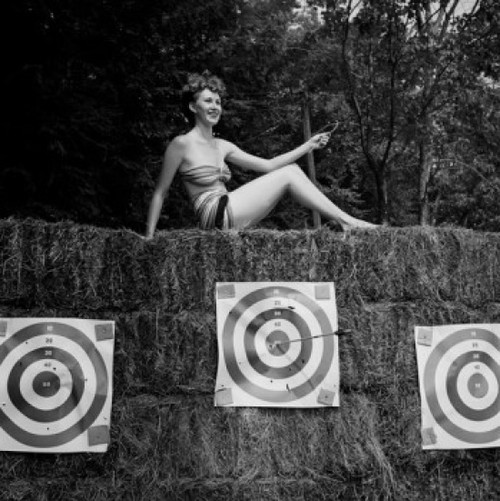 Young attractive woman sun bathing in shooting range Poster Print - Item # VARSAL255423013