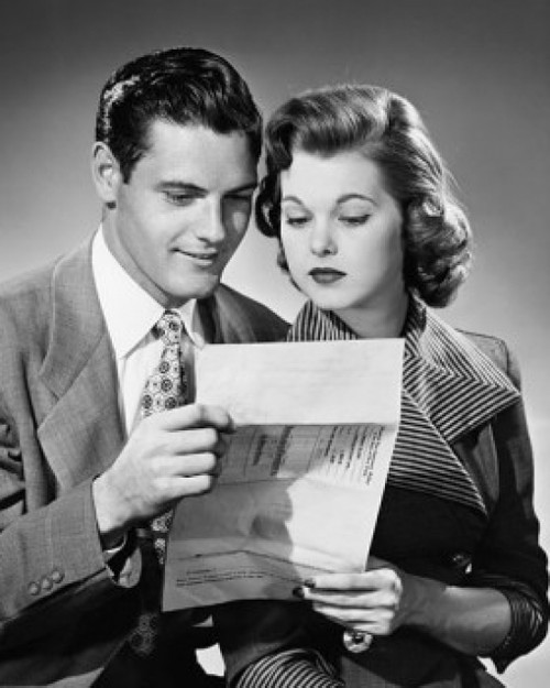 Close-up of a young couple reading a document Poster Print - Item # VARSAL2552939C