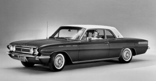 Woman sitting in a 1961 Buick Skylark Sports Coupe Poster Print - Item # VARSAL2551756