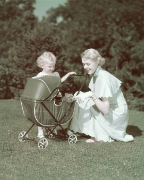 Young woman and her daughter looking at a kitten in a baby stroller Poster Print - Item # VARSAL381019171