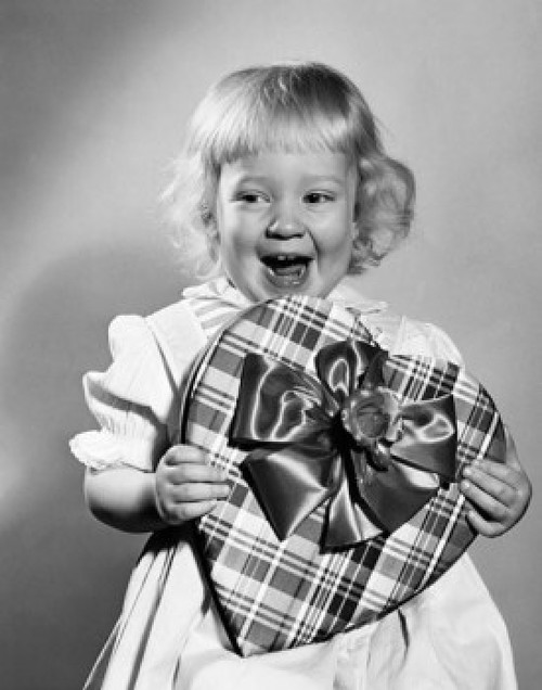 Girl holding a valentine and laughing Poster Print - Item # VARSAL25528930