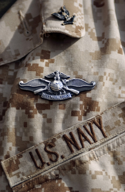 Sailors are earning their Fleet Marine Force Warfare device pin while deployed to Al Asad, Iraq. Sailors earn the right to wear the pin through an intense series of tests on Marine Corps fundamentals Poster Print - Item # VARPSTSTK101729M