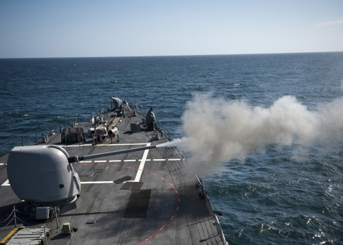 An Mk-45 lightweight gun is fired aboard guided missile destroyer USS Arleigh Burke Poster Print - Item # VARPSTSTK104859M