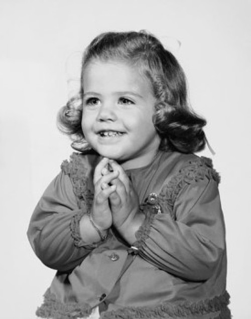 Close-up of a girl smiling with her hands folded Poster Print - Item # VARSAL25513998