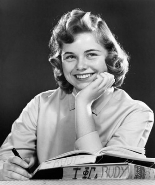 College student with her hand on her chin and smiling Poster Print - Item # VARSAL2558744B