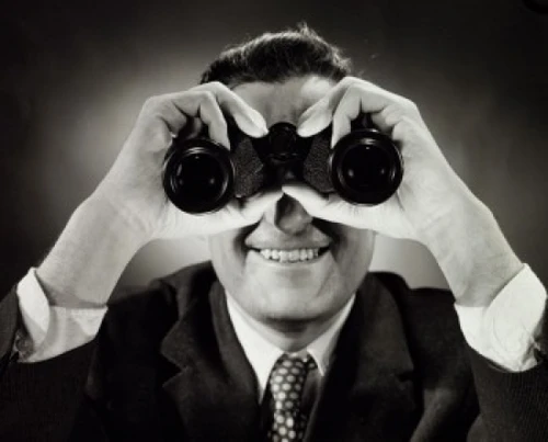 Close-up of a man looking through binoculars Poster Print