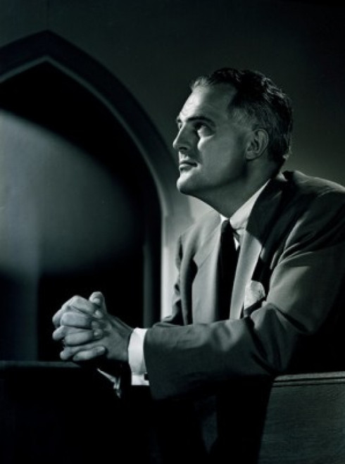 Portrait of mature man praying in church Poster Print - Item # VARSAL255416789