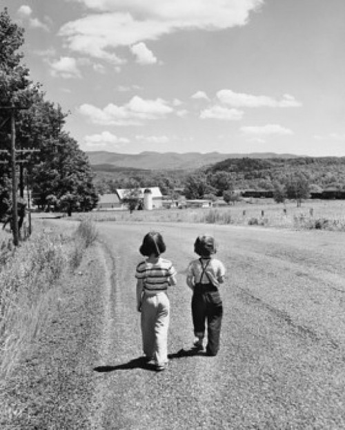 Rear view of two girls walking together on a road Poster Print - Item # VARSAL25516339