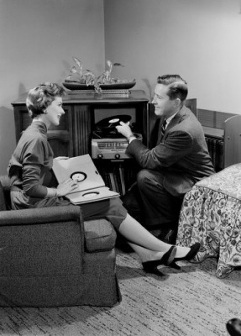 Young couple sitting in living room and listening to music Poster Print - Item # VARSAL255420125
