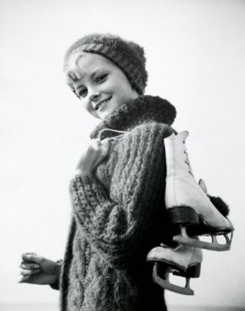 Portrait of a teenage girl carrying a pair of ice skates Poster Print - Item # VARSAL25517272B