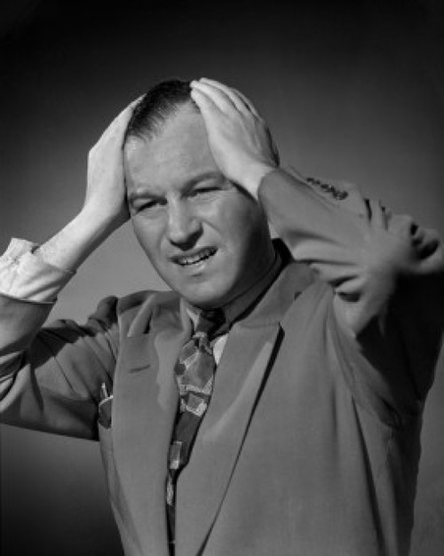 Studio portrait of man with head in hands Poster Print - Item # VARSAL25519004