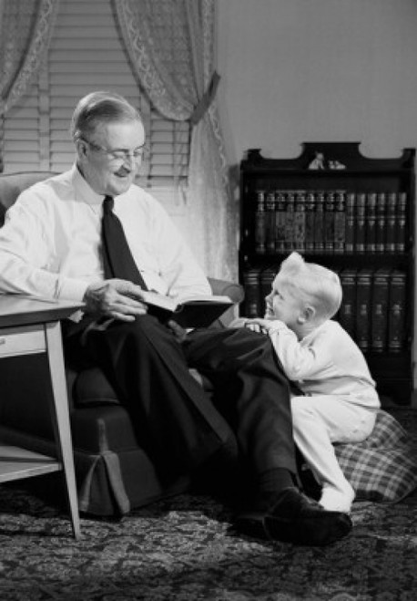Grandfather reading to grandson in living room Poster Print - Item # VARSAL255419107A
