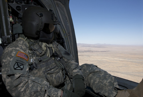 UH-60 Black Hawk crew chief takes in the view over New Mexico during exercise Angel Thunder 2013 Poster Print - Item # VARPSTTMO100952M