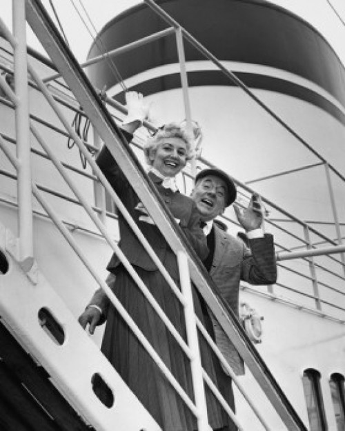 Portrait of a senior couple waving from a ship Poster Print - Item # VARSAL2552992