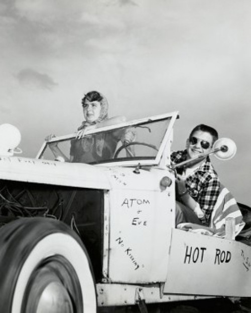 Young couple sitting in a car Poster Print